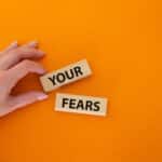 the words YOUR and FEARS on an orange background.