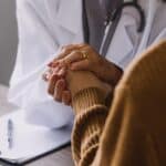 female doctor counsels patient