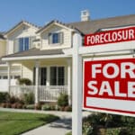 Photo of a house with a sign in front that reads FORECLOSURE: FOR SALE, indicative of the results many online sports bettors face.