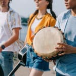 Photograph of three young people attending music therapy