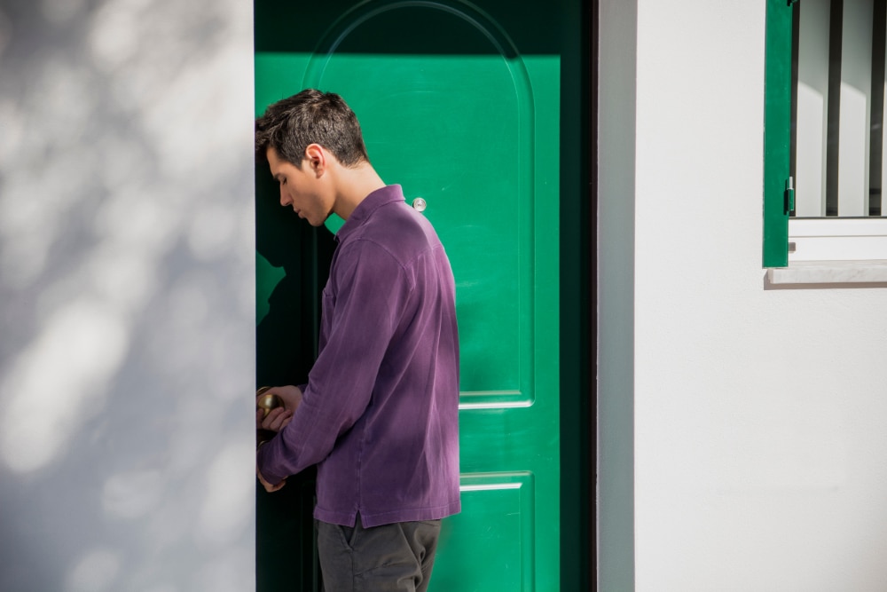 Photo of a person in drug rehab entering his room, showing the relationship between housing and addiction recovery.