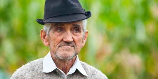 Photo of an elderly man wearing a sweater.