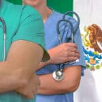 Close-up photo of addiction treatment medical team man and woman with Mexico flag in background.