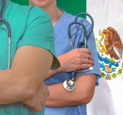 Close-up photo of addiction treatment medical team man and woman with Mexico flag in background.
