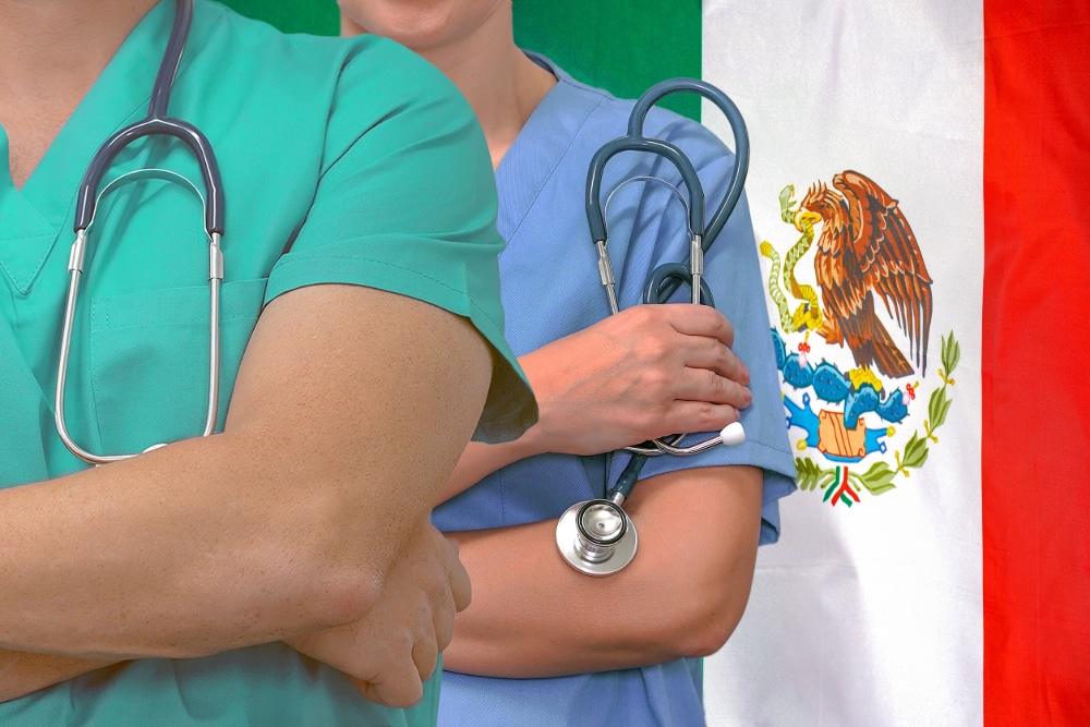 Close-up photo of addiction treatment medical team man and woman with Mexico flag in background.