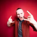 Photograph of an angry young man displaying signs of neuroticism.