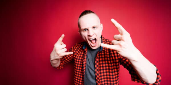 Photograph of an angry young man displaying signs of neuroticism.