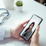 Photograph of a patient using an addiction recovery app to communicate with a medical professional.