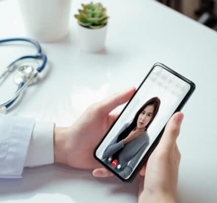 Photograph of a patient using an addiction recovery app to communicate with a medical professional.