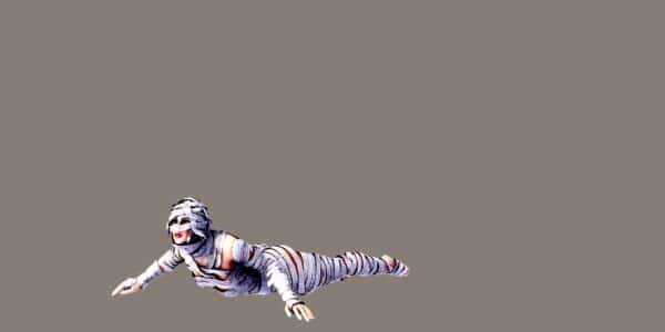 A woman crawling and wearing bandages all over her body like a mummy.