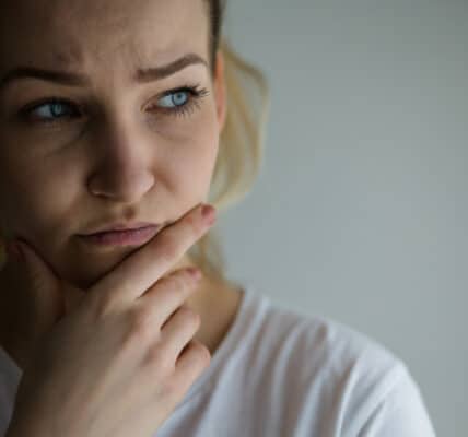 Photograph of a woman showing signs of anxiety.