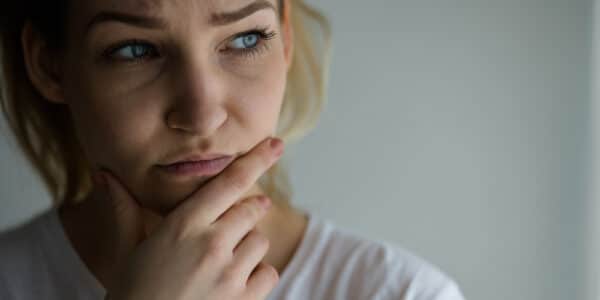 Photograph of a woman showing signs of anxiety.