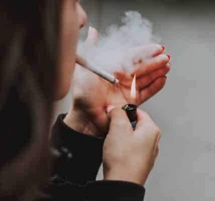 A woman smoking a cigarette.