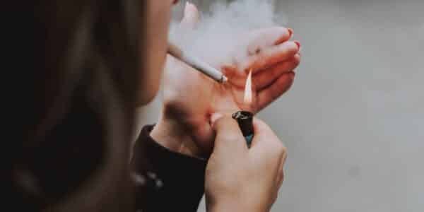 A woman smoking a cigarette.