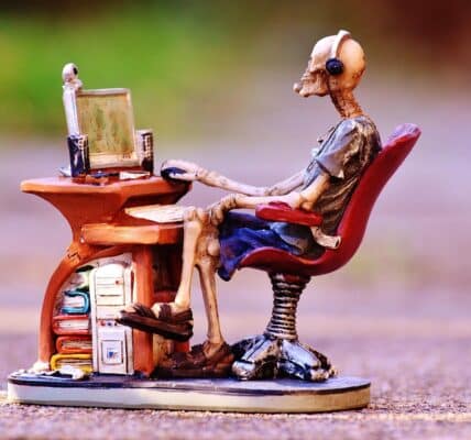 A skeleton sitting at the desk