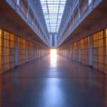 Photo of an empty corridor in an empty jail.