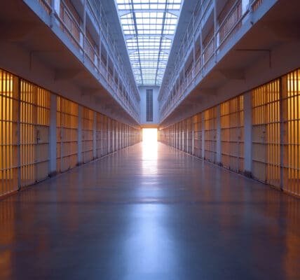 Photo of an empty corridor in an empty jail.