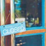 Photograph of a business door with a CLOSED sign, indicating the closure of eating disorder clinics.