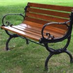 Photo of an empty park bench, symbolic of luring the homeless off park benches with affordable housing.