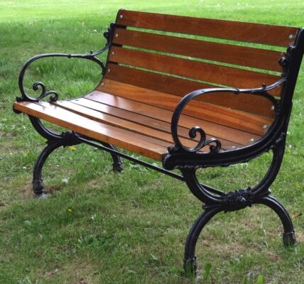 Photo of an empty park bench, symbolic of luring the homeless off park benches with affordable housing.