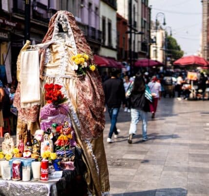 A street shrine with a statue of Santa Muerte.