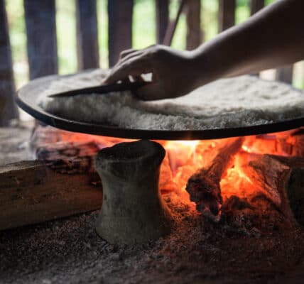 Photo of a hand over a hot fire, a metaphor for avoidance learning.