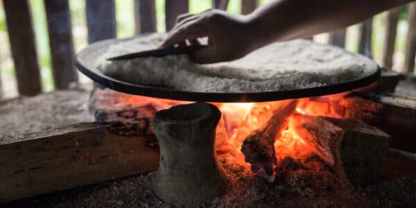 Photo of a hand over a hot fire, a metaphor for avoidance learning.