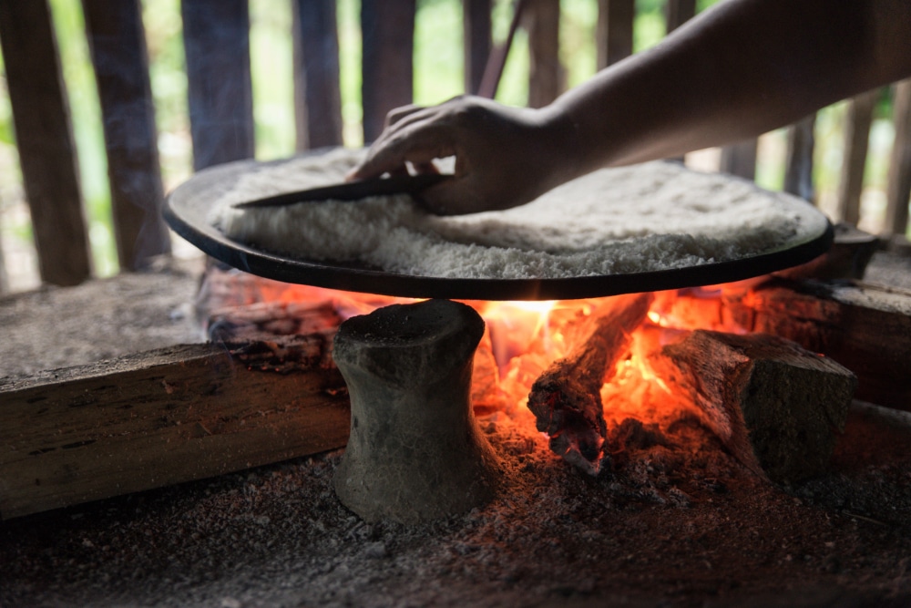 Photo of a hand over a hot fire, a metaphor for avoidance learning.