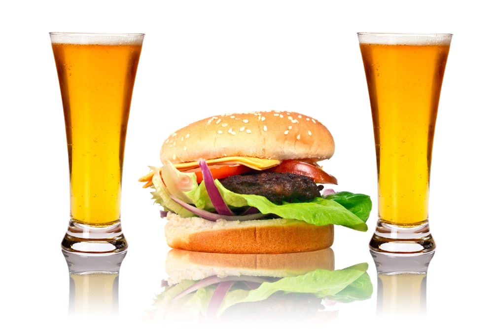 photograph of junk food between two beers.
