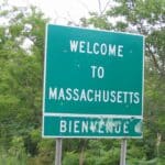 Photo of a highway sign that reads, "Welcome to Massachusetts"
