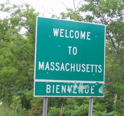 Photo of a highway sign that reads, "Welcome to Massachusetts"