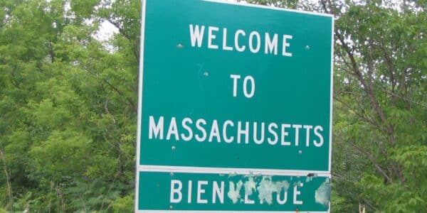 Photo of a highway sign that reads, "Welcome to Massachusetts"