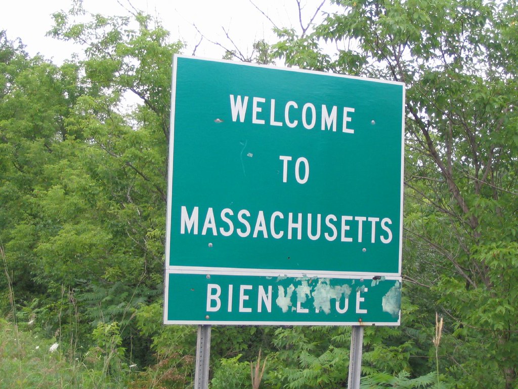 Photo of a highway sign that reads, "Welcome to Massachusetts"