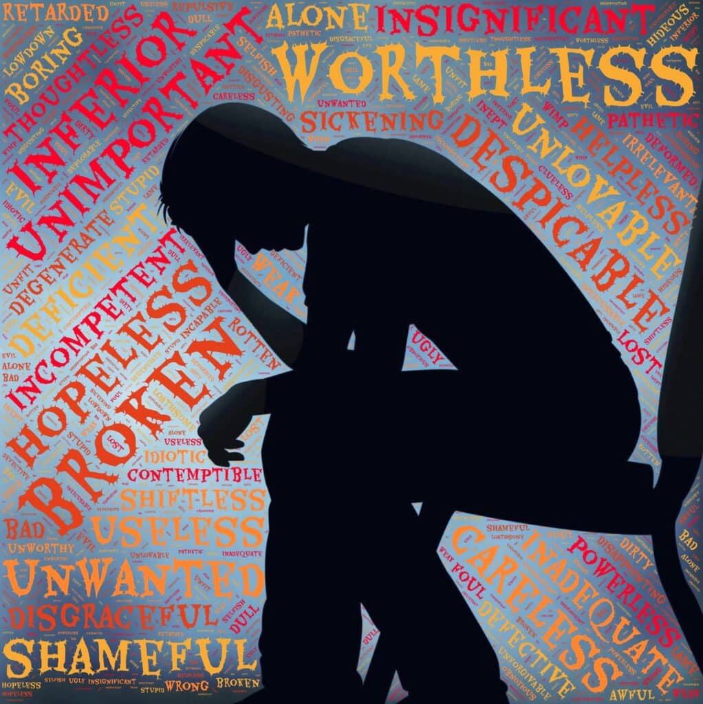 An illustration of a person having negative thoughts, represented by floating words around the person's sitting silhouette.