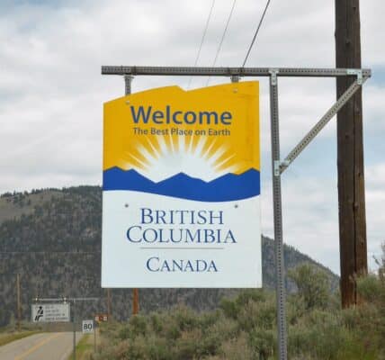 Photo of highway sign reading "Welcome to British Columbia Canada" and "The Best Place on Earth"