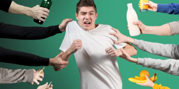 Photo of a teenager being pulled in different directions, by alcohol, tobacco, and drugs on one side and by healthy foods and drinks on the other side.