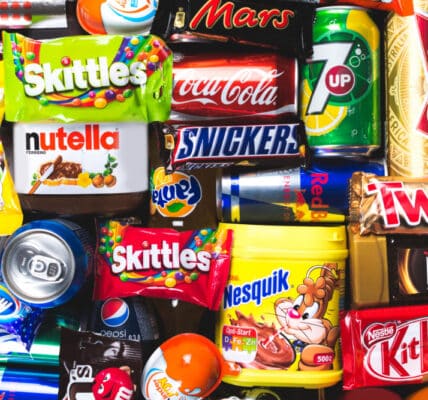 Photograph of ultra-processed junk food snacks in their original packaging.