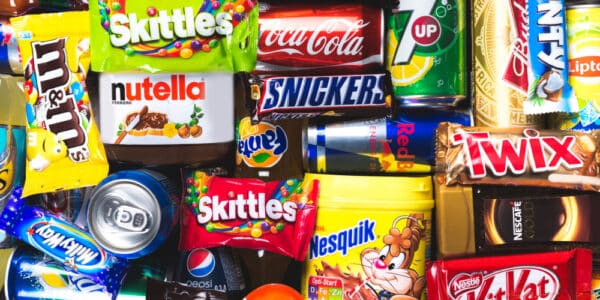 Photograph of ultra-processed junk food snacks in their original packaging.