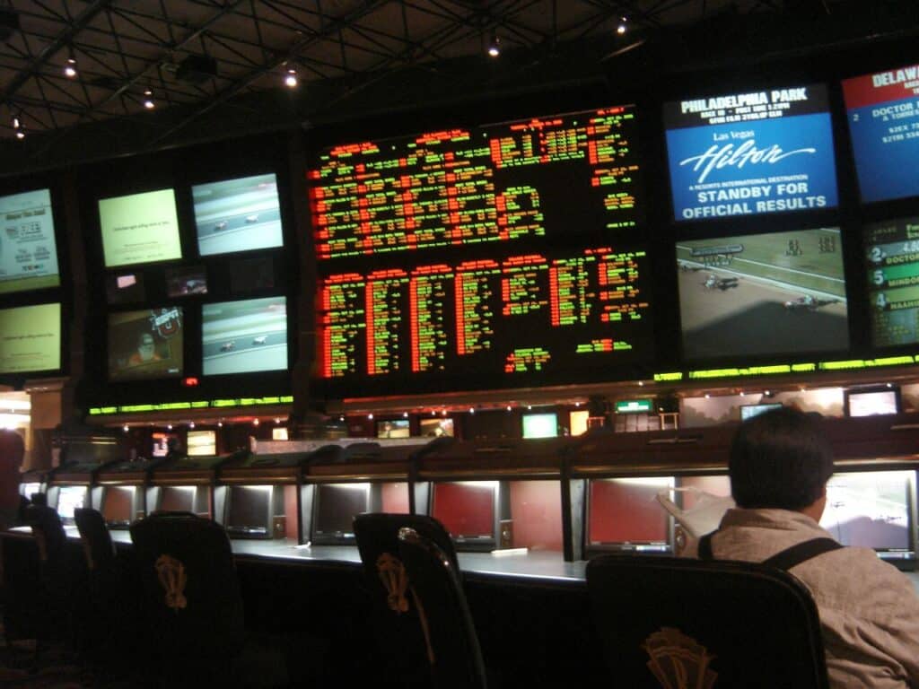 Photograph of a huge sports book at the Hilton with over 30 screens showing several different sports and games at once.