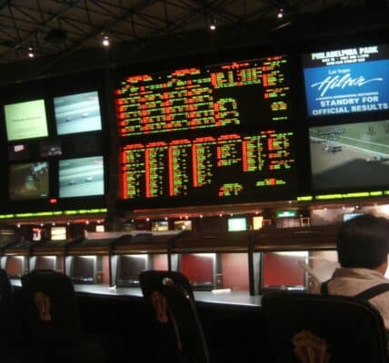 Photograph of a huge sports book at the Hilton with over 30 screens showing several different sports and games at once.
