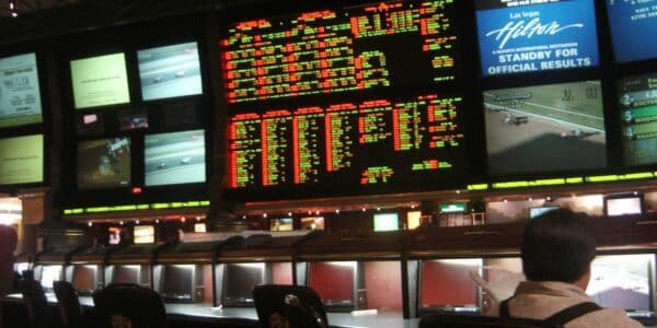 Photograph of a huge sports book at the Hilton with over 30 screens showing several different sports and games at once.