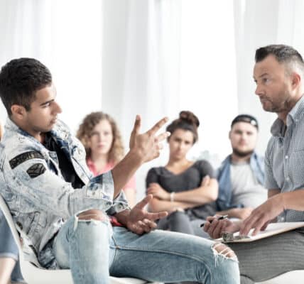 Group therapy session with teens being treated for smartphone addiction.