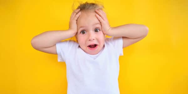 Photo of a child with a stressed expression.
