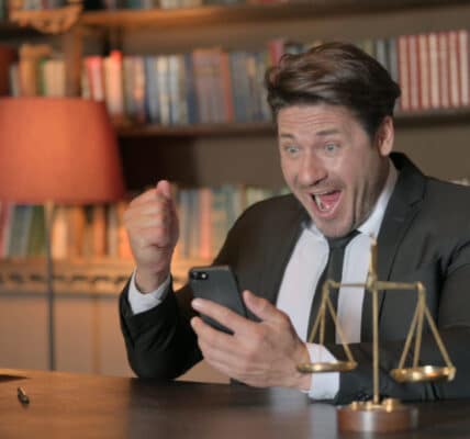 Photo of an attorney celebrating a victory against gambling syndicates.