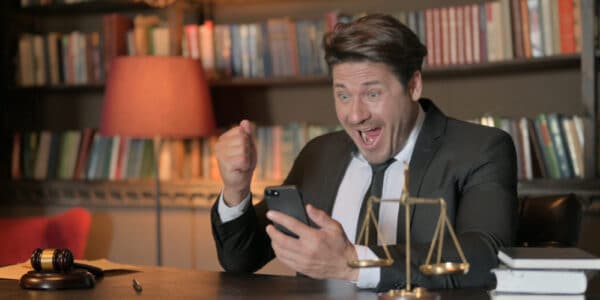 Photo of an attorney celebrating a victory against gambling syndicates.