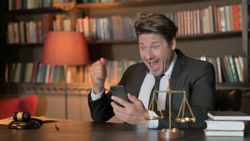 Photo of an attorney celebrating a victory against gambling syndicates.