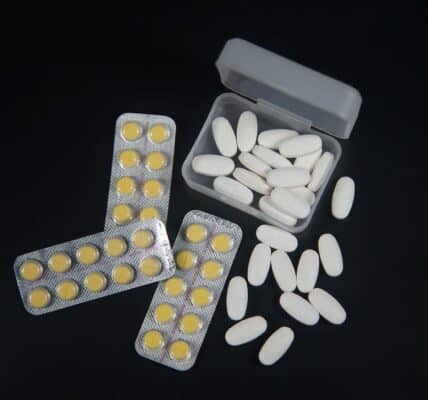 A variety of pills against the black background.