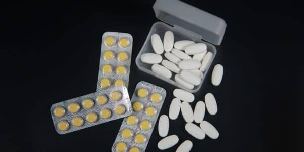 A variety of pills against the black background.