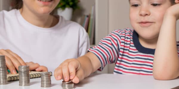 Photo of a woman teaching a child how to gamble.