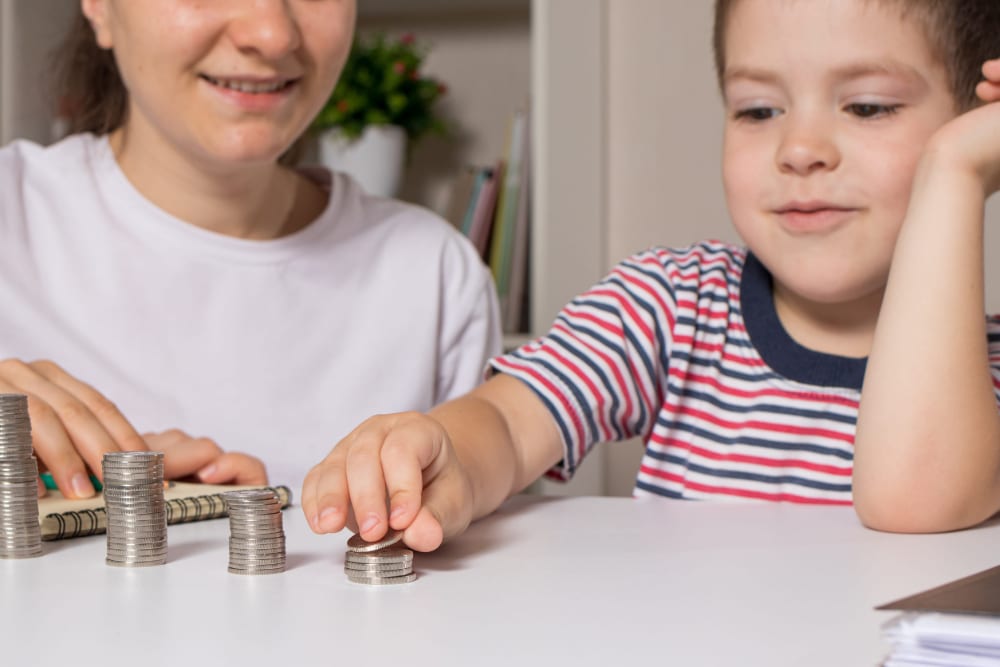 Photo of a woman teaching a child how to gamble.
